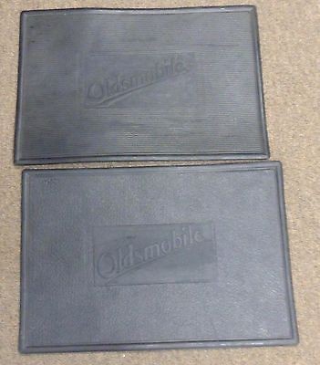 Two Oldsmobile Floor Mats