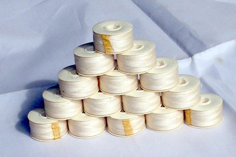 144 Pre Wound Paper Bobbins 100% Polyester Thread. Ecru