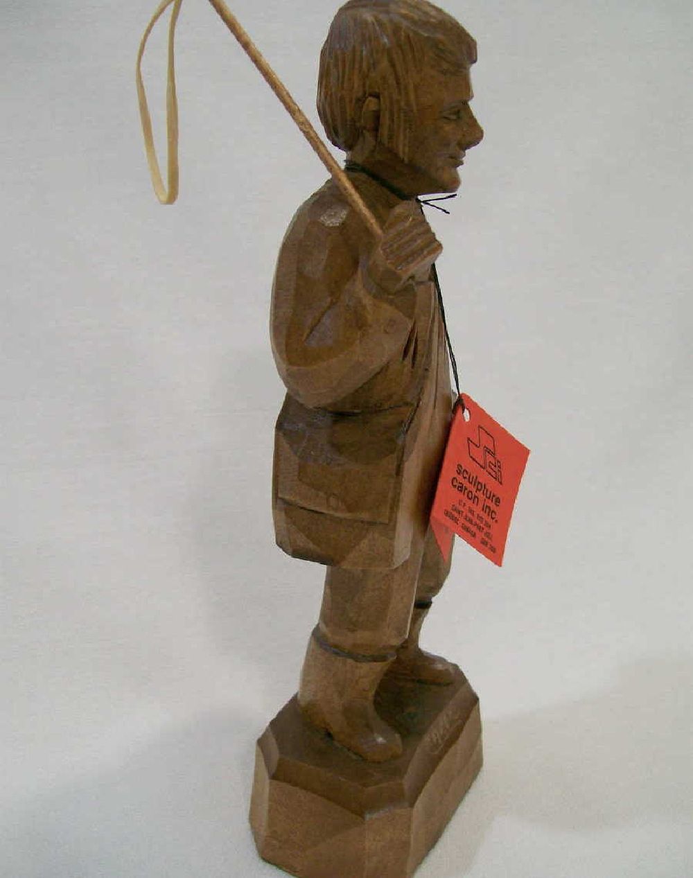 Old stock. Quebec carver signed Caron   Young man with fishing rod.