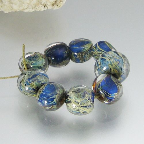  beads and one round bead, made by me, Deborah Smith, in my studio