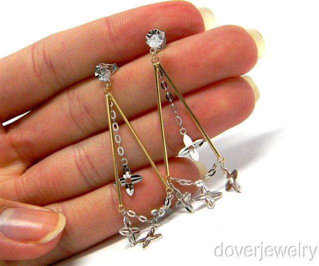 These playful estate dangle earrings are crafted in solid 14K yellow