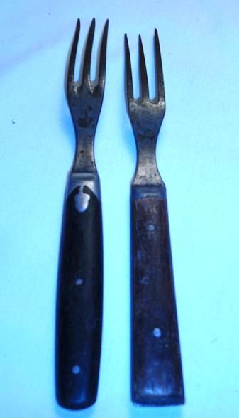 these are mid 1800 s 3 tine forks with wooden handles i would say