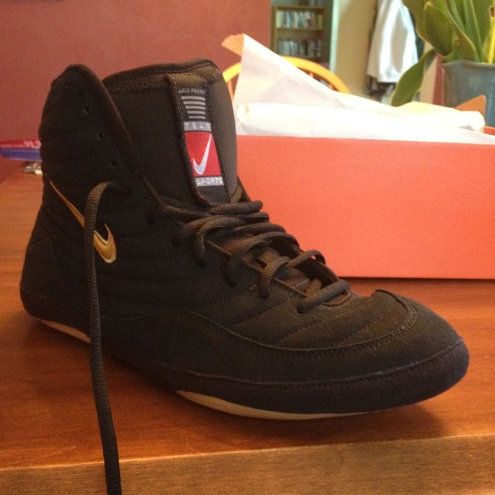 nike inflicts black and gold