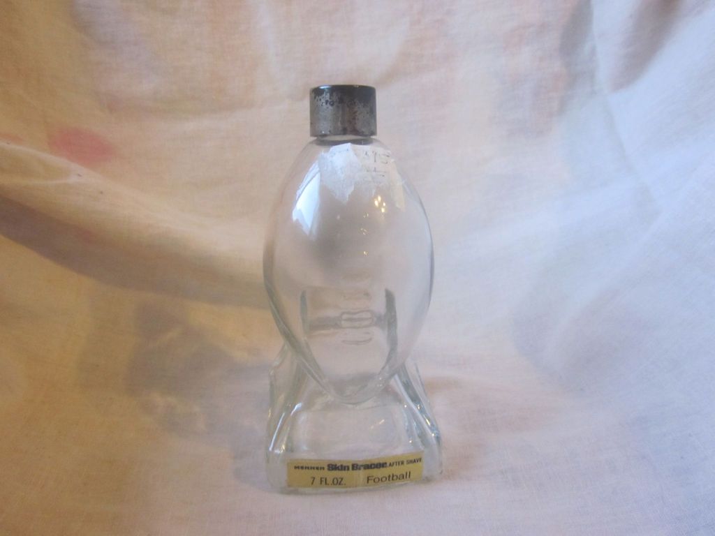 ANTIQUE MENNEN SKIN BRACER AFTER SHAVE GLASS FOOTBALL BOTTLE 7 FL OZ