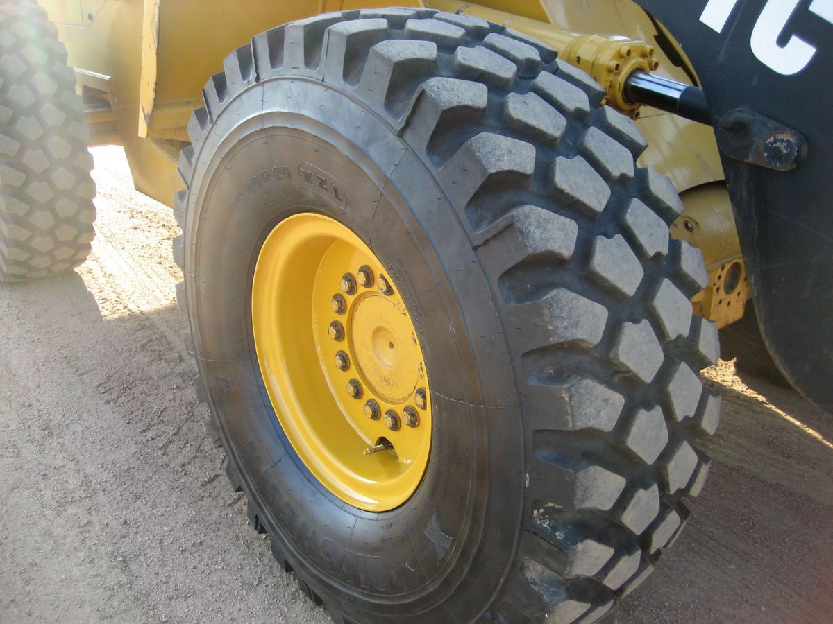 SET OF FOUR MICHELIN XZL RADIALS AND RIMS FOR JOHN DEERE WHEEL LOADER